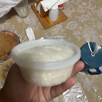 El Nuevo Bohio Lechonera - a hand holding a bowl of yogurt - Dominican Near Me - Bronx, New York El Nuevo Bohio Lechonera - a hand holding a bowl of yogurt - Dominican Near Me - Bronx, New York