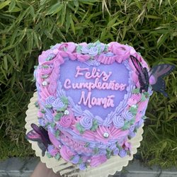 6"2 layer heart cake with buttercream frilly bows and butterflies