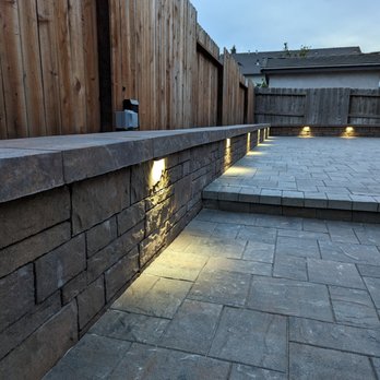 Choice One Landscape - a stone wall with lights - Landscaping Near Me Choice One Landscape - a stone wall with lights - Landscaping Near Me
