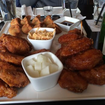 Bonchon Arlington - 20 pcs split half/half.  mandoo in background.  soju on side - Chicken Wings Near Me - Arlington, Virginia