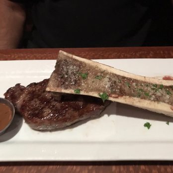Downtown Kitchen - Ribeye with bone marrow canoe. - New American Near Me - Canton, Georgia