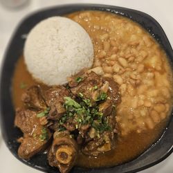 Sol Boulevard - Seco Combinado Beef stew in cilantro sauce with beans and rice.