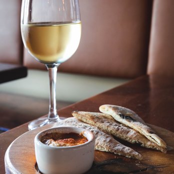 Pizzeria Seven Twelve - White wine with the pita and hummus appetizer. - Pizza Near Me - Orem, Utah Pizzeria Seven Twelve - White wine with the pita and hummus appetizer. - Pizza Near Me - Orem, Utah