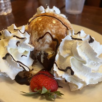 The Mucky Duck - Homemade walnut brownie with vanilla ice cream and whipped cream! - Seafood Near Me - Captiva, Florida The Mucky Duck - Homemade walnut brownie with vanilla ice cream and whipped cream! - Seafood Near Me - Captiva, Florida