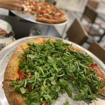Apogee - a pizza on a pan with a slice taken out of it - Pizza Near Me - Olathe, Kansas Apogee - a pizza on a pan with a slice taken out of it - Pizza Near Me - Olathe, Kansas