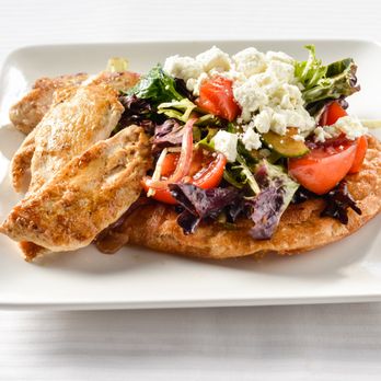 Munch Buffalo - Spring mix, tzatziki, shaved red onion, feta, marinated cucumber and tomato salad, crispy fried flat bread - New American Near Me - Buffalo, New York Munch Buffalo - Spring mix, tzatziki, shaved red onion, feta, marinated cucumber and tomato salad, crispy fried flat bread - New American Near Me - Buffalo, New York