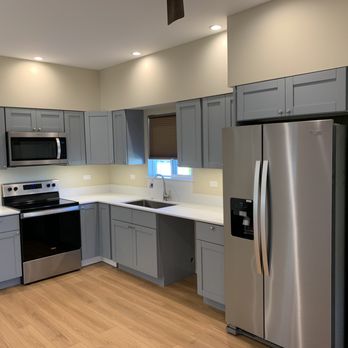 Creative Builders Maui - Modern kitchen renovation featuring custom shaker cabinets, stainless steel appliances, quartz countertops, and soft-close drawers - General Contractors Near Me - Makawao, Hawaii