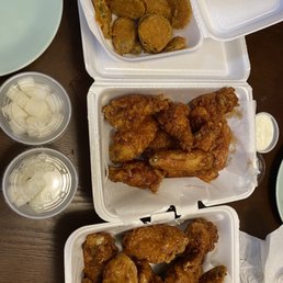 Half soy, half spicy bone in wings with fried pickles and daikon