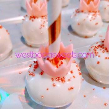 West Boca Sweets - a close up of a cake with white frosting and red sprinkles - Cupcakes Near Me West Boca Sweets - a close up of a cake with white frosting and red sprinkles - Cupcakes Near Me