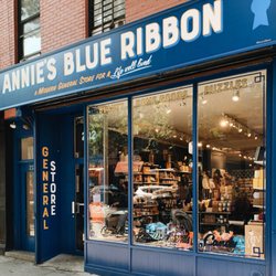 Annie's Blue Ribbon General Store - New storefront with sign.