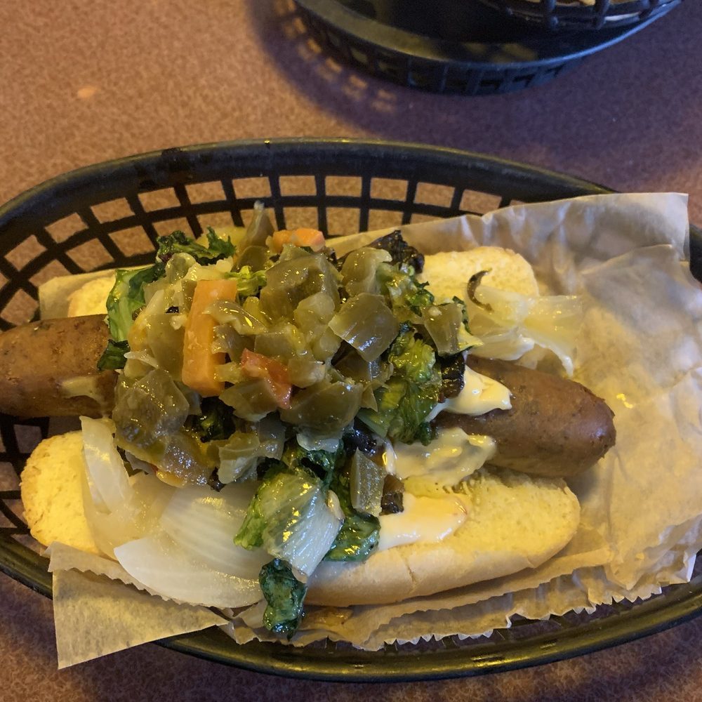 Happy Dog - Artisan vegan dog with marinated mushrooms, garlic escarole, Italian giardineira, caramelized onions, and roasted garlic aioli. - Bars Near Me - Cleveland, Ohio Happy Dog - Artisan vegan dog with marinated mushrooms, garlic escarole, Italian giardineira, caramelized onions, and roasted garlic aioli. - Bars Near Me - Cleveland, Ohio