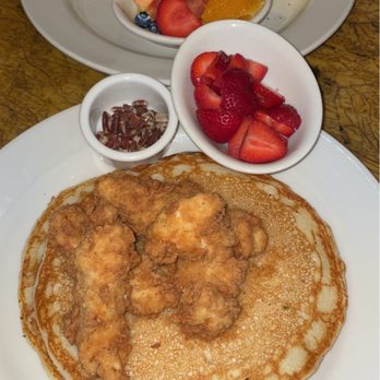 Grand Lux Cafe - Pancakes and chicken side of strawberries and my friends food a omelette with fruit - Desserts Near Me - Dallas, Texas Grand Lux Cafe - Pancakes and chicken side of strawberries and my friends food a omelette with fruit - Desserts Near Me - Dallas, Texas