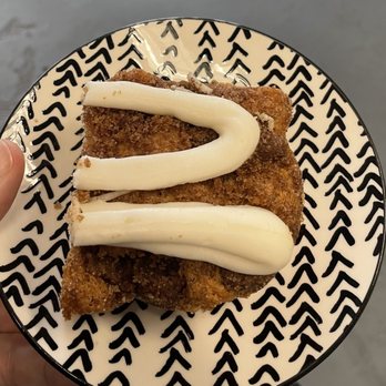 Simply Poured - a hand holding a piece of cake - Coffee & Tea Near Me - Madisonville, Kentucky Simply Poured - a hand holding a piece of cake - Coffee & Tea Near Me - Madisonville, Kentucky
