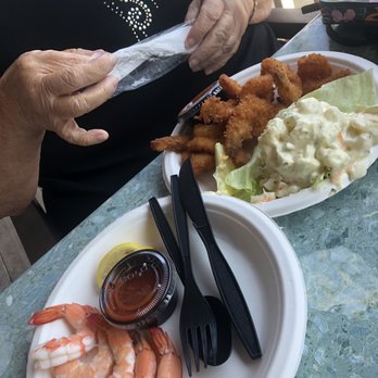 Crabby Jack’s Bayside Bar - Shrimp cocktail on the left, fried shrimp platter with side of potato salad. - Seafood Near Me - Somers Point, New Jersey