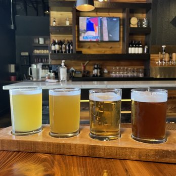 Republic Pi - four different beers on a wooden tray - Pizza Near Me - Spokane, Washington
