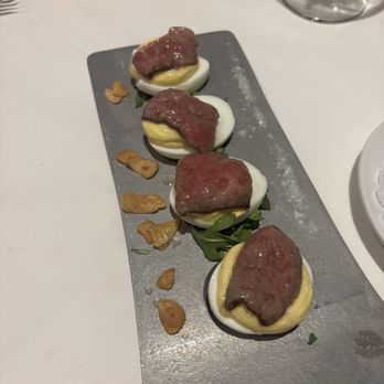 Porch and Parlor - Deviled egg appetizer with A5 Wagu beef, roasted garlic and salt - Steakhouses Near Me - Memphis, Tennessee Porch and Parlor - Deviled egg appetizer with A5 Wagu beef, roasted garlic and salt - Steakhouses Near Me - Memphis, Tennessee