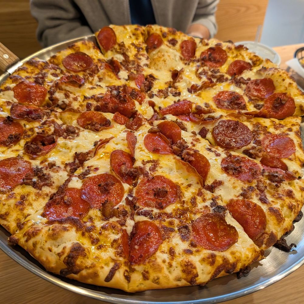 Large Pepperoni with Bacon and Their garlic white sauce.