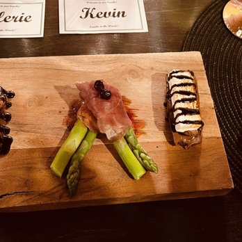 Candle in the Woods - a plate of food on a table - Wine Bars Near Me - Athol, Idaho