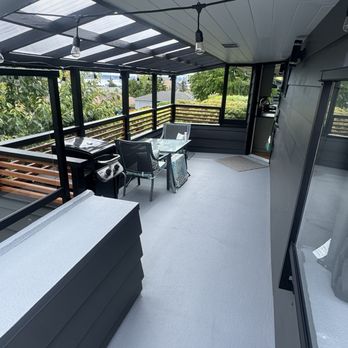 Open Space Design - Covered deck Reno- new frame, clear roofing and wood railing. - Decks & Railing Near Me - Seattle, Washington Open Space Design - Covered deck Reno- new frame, clear roofing and wood railing. - Decks & Railing Near Me - Seattle, Washington