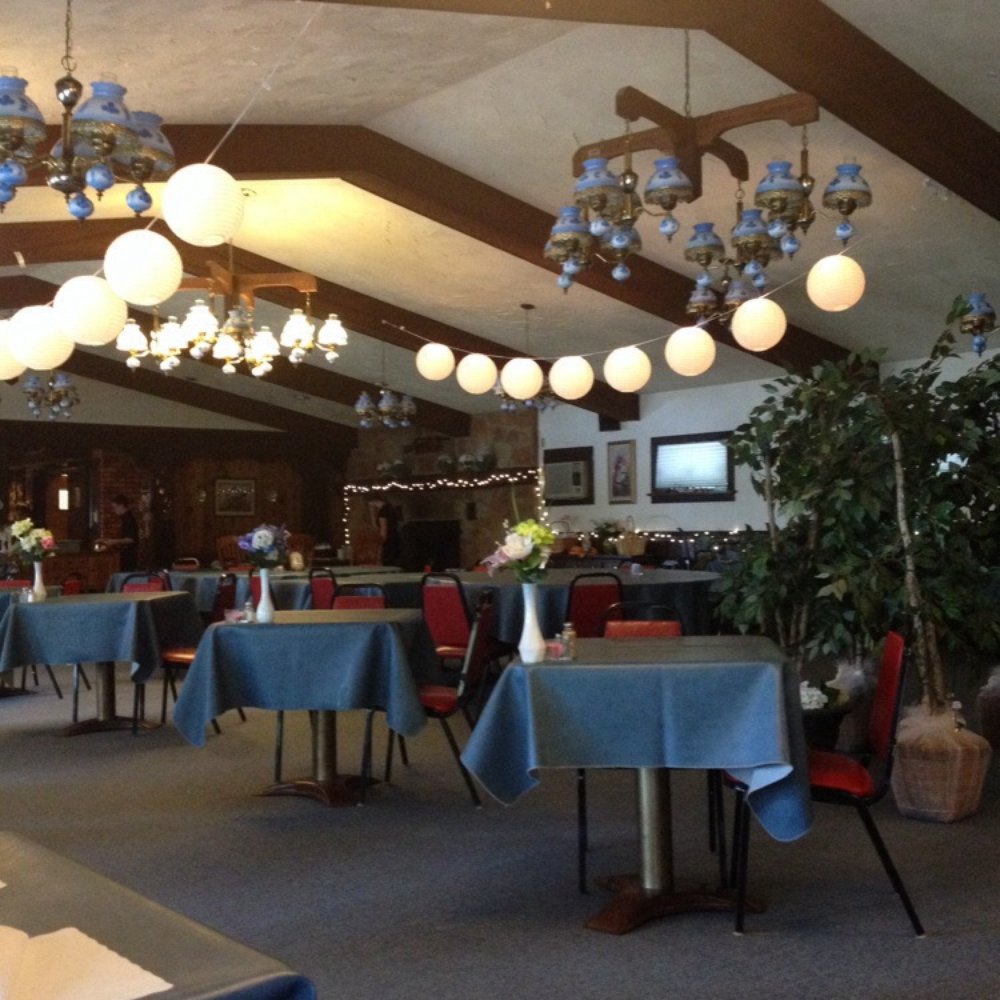 tables and chairs with blue tablecloths