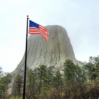 Devils Tower KOA - Image of Devils Tower and USA flag - Campgrounds Near Me - Devils Tower, Wyoming