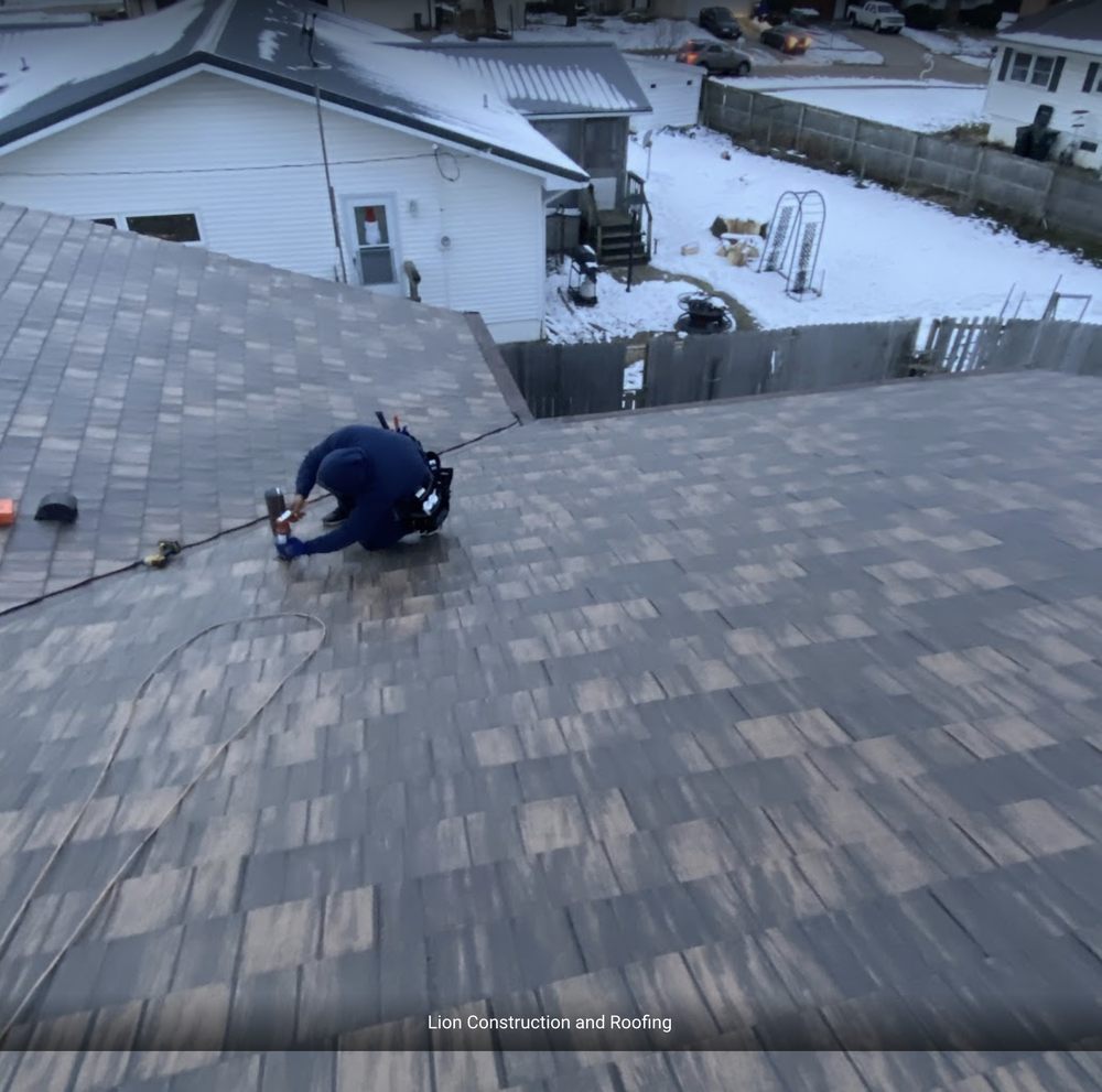 Slide of Lion Construction and Roofing