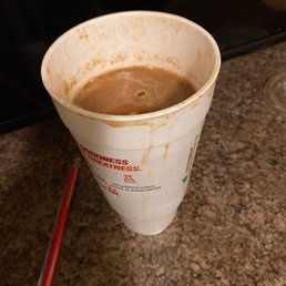 a cup of coffee on a counter a cup of coffee on a counter
