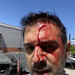 Shop owner tried to extort money from me and attacked me.