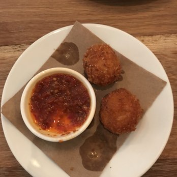 Altro Paradiso - Half of the arancini (rice and fontina fritters). A must! We ate two of them before remembering to take a photo - whoops. - Italian Near Me - New York, New York