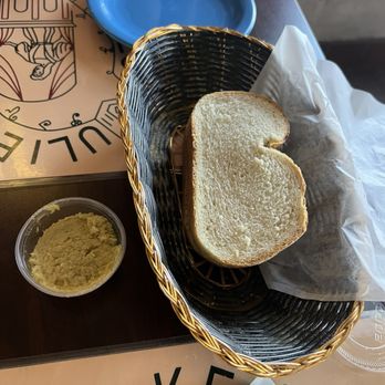 Romeo & Juliet Cafe - Fresh bread comes to the table with an olive tapenade - Italian Near Me - Buffalo, New York Romeo & Juliet Cafe - Fresh bread comes to the table with an olive tapenade - Italian Near Me - Buffalo, New York