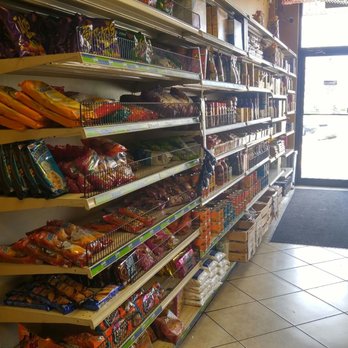 La Costeñita - A few grocery items on the racks next to the dining tables. - Mexican Near Me - Hillsborough, New Jersey