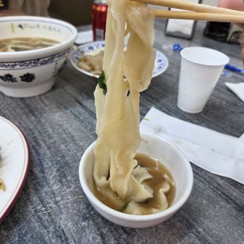 Big Dan Shanxi Taste - This is one length of noodle, bunched up a bit, from #21 Hot & Spicy Noodle Soup w/ Braised Beef ($13.99) - Chinese Near Me - Las Vegas, Nevada Big Dan Shanxi Taste - This is one length of noodle, bunched up a bit, from #21 Hot & Spicy Noodle Soup w/ Braised Beef ($13.99) - Chinese Near Me - Las Vegas, Nevada