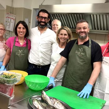 The International Kitchen - With the chef and his team, preparing fresh trout that was caught 5 minutes earlier from the stream behind the restaurant! - Travel Services Near Me - Chicago, Illinois