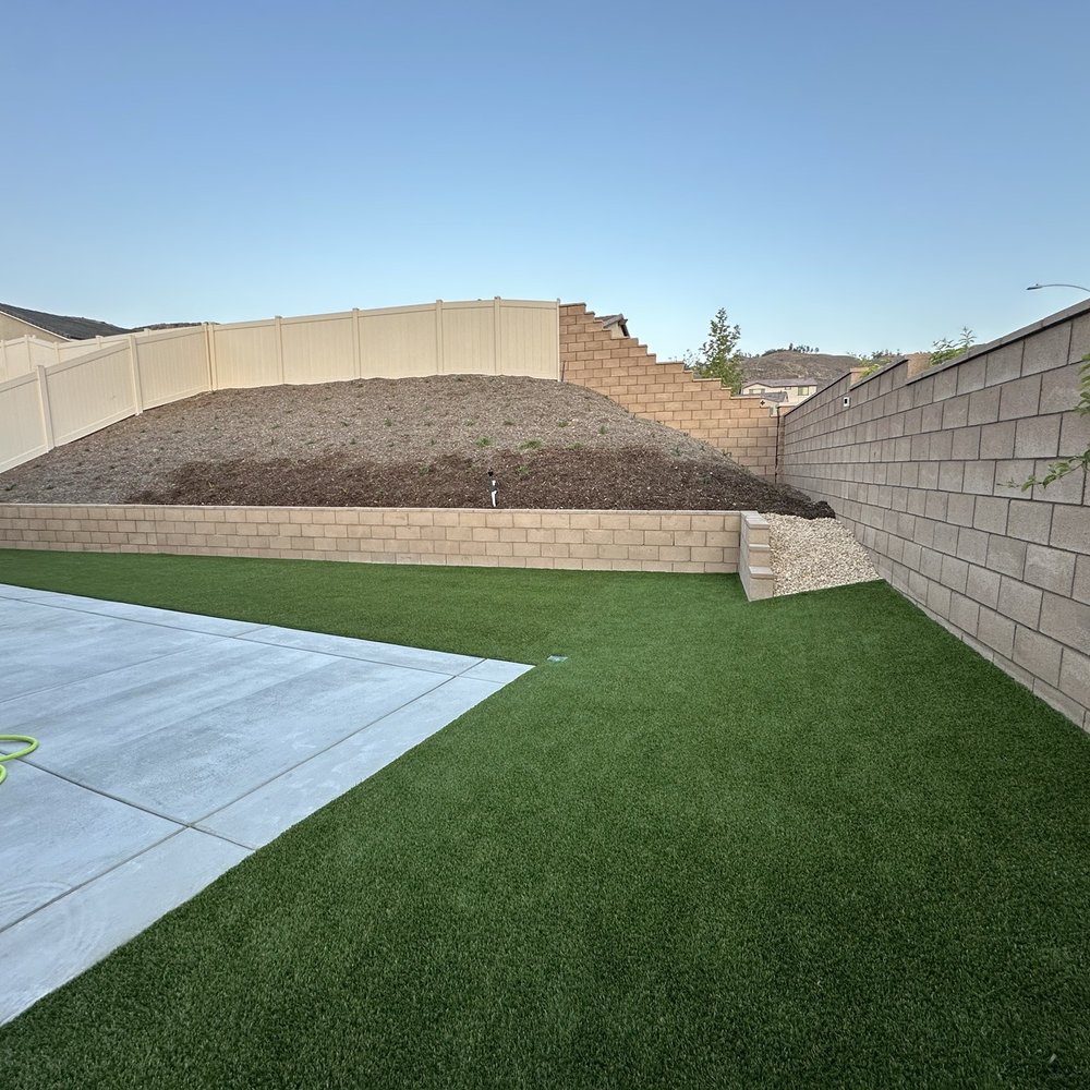 Monarch Landscape And Design - The after! Turf, retaining wall and concrete. - Landscape Architects or Designers Near Me - Hesperia, California Monarch Landscape And Design - The after! Turf, retaining wall and concrete. - Landscape Architects or Designers Near Me - Hesperia, California