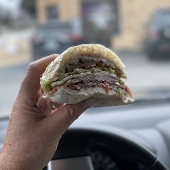 Vitale's Deli - a hand holding a sandwich - Delis Near Me - Saint Louis, Missouri Vitale's Deli - a hand holding a sandwich - Delis Near Me - Saint Louis, Missouri