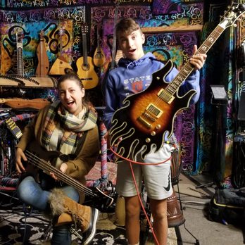 Bradley Fish Guitar Lessons - Eli and me enjoying Bradley's studio! - Musical Instruments & Teachers Near Me - Madison, Wisconsin Bradley Fish Guitar Lessons - Eli and me enjoying Bradley's studio! - Musical Instruments & Teachers Near Me - Madison, Wisconsin