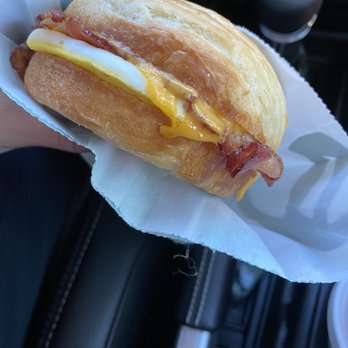 Starbucks - a person holding a sandwich in their hand - Coffee & Tea Near Me - Bellevue, Nebraska