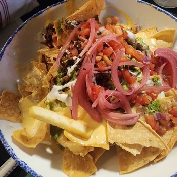 Paradiso 37 - Gross looking nachos that were cold and even threw in a cold one songle French fry in the mix. Also soggy chips. - Latin American Near Me - Orlando, Florida