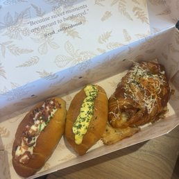 bacon and scallion, egg sando salt bread; ham and cheese croissant