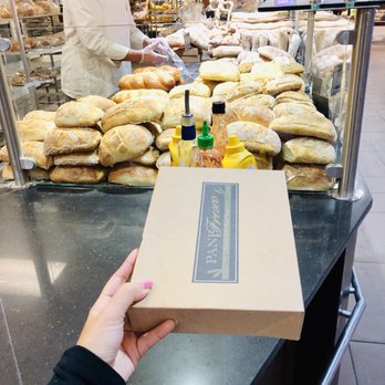 Pane Fresco - a person holding a box of bread - Pizza Near Me - Stoney Creek, Ontario Pane Fresco - a person holding a box of bread - Pizza Near Me - Stoney Creek, Ontario