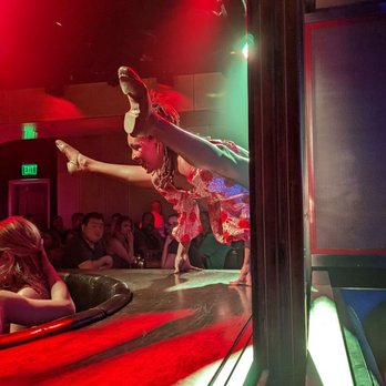 Superfrico - Solo acrobatic performer doing a balancing act on a banquet in the bar area. - Italian Near Me - Las Vegas, Nevada