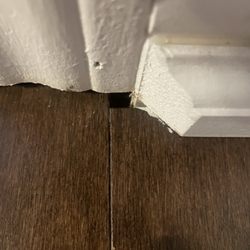 The Hardwood Flooring Stores - A hole in the floor where the plank wasn't cut oroperly