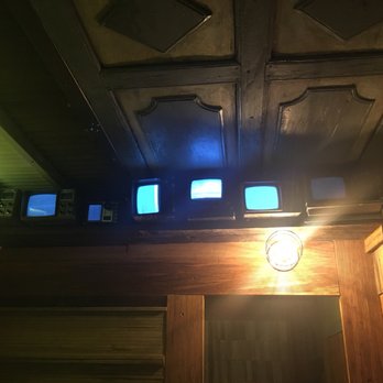 Bricolage - Bathroom with old, small TVs and ironing board that was locked to the wall. - Vietnamese Near Me - Brooklyn, New York Bricolage - Bathroom with old, small TVs and ironing board that was locked to the wall. - Vietnamese Near Me - Brooklyn, New York