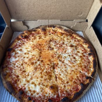 ZaVino - Classic Americano - A cheese pizza with melted cheese and a slightly charred crust in an open pizza box. - Italian Near Me - Baltimore, Maryland