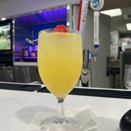 Tequila & pineapple with a cherry