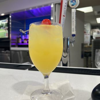 Delta Sky Club - Tequila & pineapple with a cherry - Airport Lounges Near Me - Jamaica, New York
