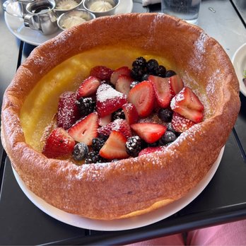 Plums Cafe - Dutch baby with berries - Breakfast & Brunch Near Me - Costa Mesa, California Plums Cafe - Dutch baby with berries - Breakfast & Brunch Near Me - Costa Mesa, California