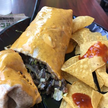 Tijuana Flats - The mega steak burrito with cheese - Mexican Near Me - St. Petersburg, Florida Tijuana Flats - The mega steak burrito with cheese - Mexican Near Me - St. Petersburg, Florida