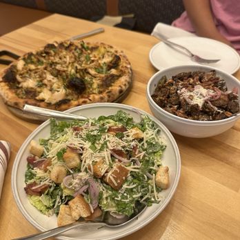 d’Alba - crispy brussels, chopped romaine caesar, roasted artichoke, pesto, five-cheese blend, caramelized onion, fresh basil, added chicken pizza - New American Near Me - Houston, Texas d’Alba - crispy brussels, chopped romaine caesar, roasted artichoke, pesto, five-cheese blend, caramelized onion, fresh basil, added chicken pizza - New American Near Me - Houston, Texas