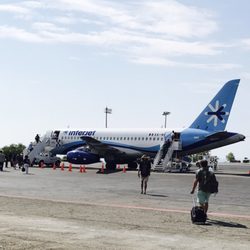 Aeropuerto Internacional de Puerto Escondido - Hubby walking out on the tarmac Like a rock star LOL